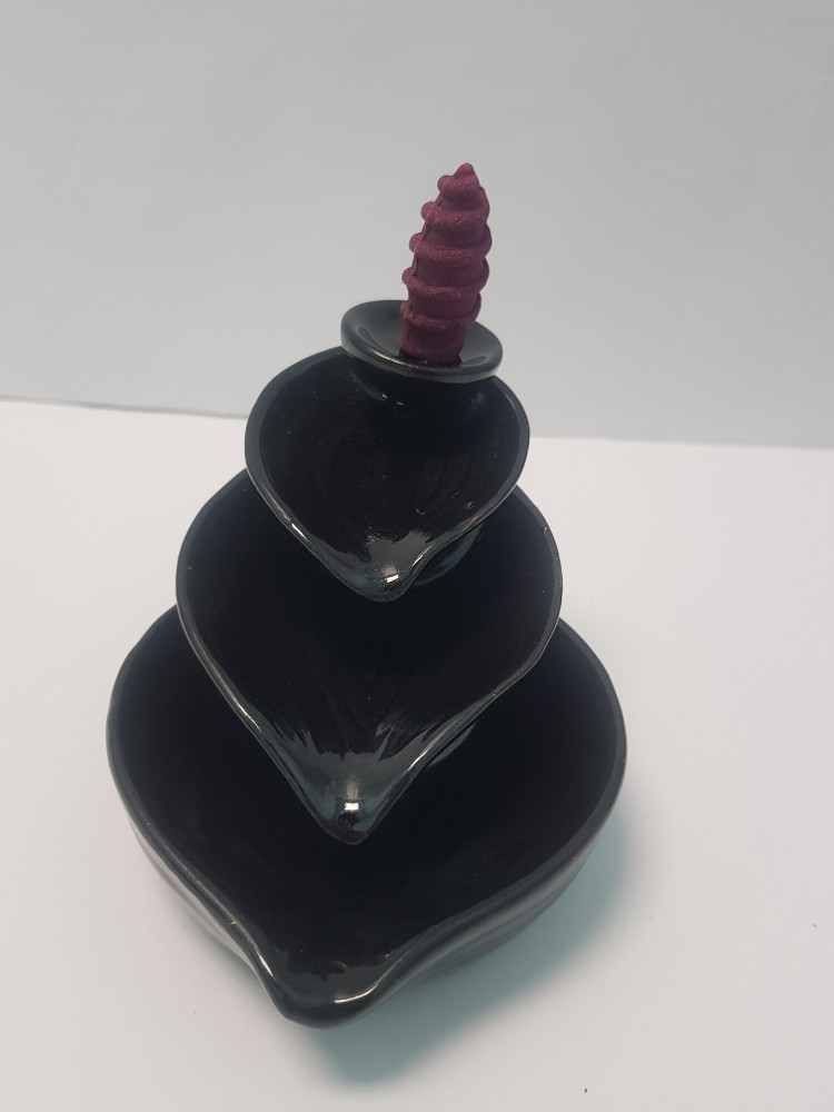 Ceramic leaf-drop backflow
