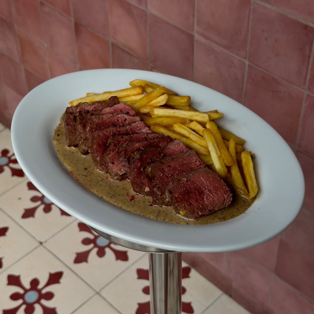 Steak Mignon with fries and pepper sauce d